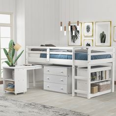 a white loft bed with drawers underneath it and a desk in the corner next to it