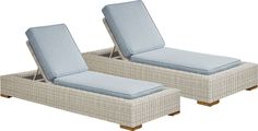 two wicker lounge chairs with blue cushions on white background for use in outdoor furniture