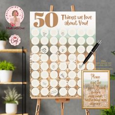 an easel with a sign that says 50 things we love about you