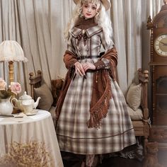 A plaid dress that will make you look like an elegant British young lady. The design looks like a turtleneck worn inside. The style is high-waisted and the back is decorated with lace-up and ribbon. Pairing it with a belt will make your whole look look tighter. 
 
 

 

 
 
 ＜Item＞ 
 
 Long length 
 Standard length 
 Middle length 
 
 
 ＜Size＞ 
 
 Long length 
 
 S size 
 
 Length: 120cm 
 Upper body length: 40cm 
 Shoulder width: 35.5cm 
 Bust: 86cm 
 Waist: 68cm 
 Sleeve length: 60cm 
 
 M siz Vintage Plaid Winter Dress, Vintage Plaid Dress For Winter, Brown Plaid, Plaid Dress, Long Length, Upper Body, Long Dress, Brown And Grey, Tights