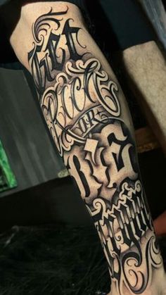 a man's leg with some lettering on it