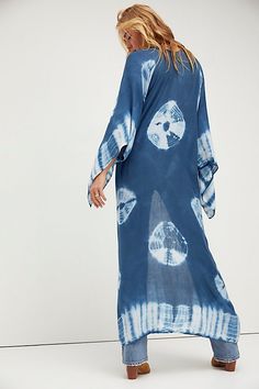 In a super soft fabric and tie dye pattern this oversized maxi kimono features statement cutout detailing under the arms. Blue Breezy Flowy Cover-up, Blue Flowy Breezy Cover-up, Flowy Long Cover-up For Vacation, Long Flowy Cover-up For Vacation, Bohemian Rayon Cover-up For Vacation, Bohemian Lightweight Cover-up For Beach Party, Beachy Cover-up With Kimono Sleeves For Festivals, Blue Flowy Cover-up For Beach Season, Flowy Unlined Cover-up For Vacation