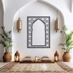 a room decorated in white and brown with decorative decorations on the wall, potted plants and candles