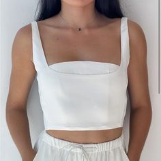 This Pure White Top Is An Elevation To Your Wardrobe As It Offers Adjustable Straps Flattering To The Neckline. Keep It Stylish And Comfortable By Tightening To Your Likeness With Hidden Seamless Clasps. Washing Instructions: Dry Clean Only Fabric Content: 95% Polyester, 5% Spandex Imported Model Wears Size Extra Small. White Square Neck Crop Top, White Square Neck Top For Party, Dot Tops, White Tops, Womens Tops, Tank Tops, Wardrobe, White, Pure Products