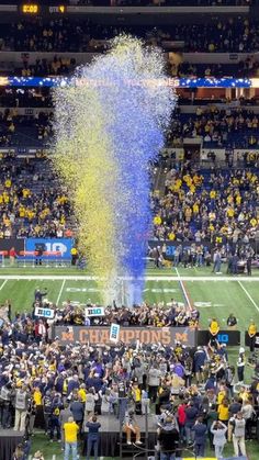 a football stadium filled with fans and confetti