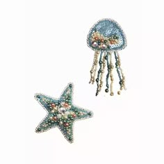 two starfishs with beads and pearls on them