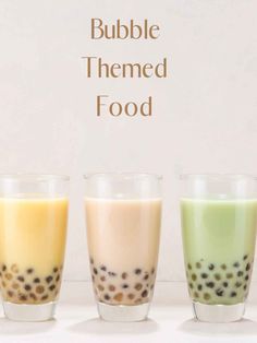 three glasses filled with different colored liquids and the words bubble themed food above them