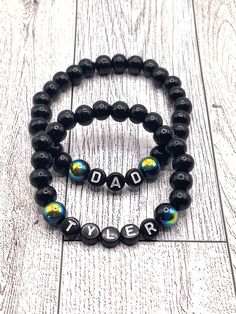 💙Personalized Black Wooden Dad and Son/Daughter Bracelet with a touch of color, we added two black shell beads to this listing. This will make any dad or granddad's day to wear matching bracelets with their kids or grandkids! Will arrive in a black satin organza bag or jewelry box ready for gifting, your choice! (This listing is for ONE bracelet only) Dad Bracelet, Daughter Bracelet, Son Bracelet, Bracelet Matching, Mom Bracelet, Dad And Son, Moms Bracelet, Preppy Stuff, Personalized Bracelet