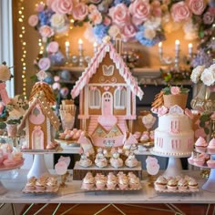 a table topped with lots of cakes and cupcakes