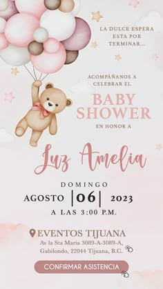 a baby shower party with balloons and a teddy bear flying in the sky above it