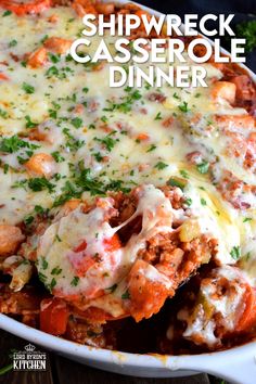 a casserole dish with meat and cheese on the side, topped with parsley