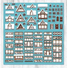 a blue paper cutout with buildings and windows