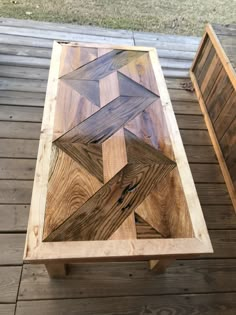 a wooden table sitting on top of a wooden floor