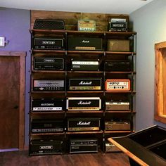 the room has many old radio's in it, including one that is on top of a shelf