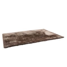 a brown rug on top of a white floor