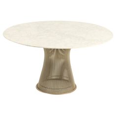 an oval table with white marble top and wicker base, viewed from the front