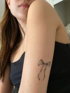 feminine tattoo, aura, womens fine line tat, tatted up, bow tattoo, ribbon dainty tattoo, lana del rey inspired tattoo, womens tattoo on arm A Bow Tattoo, Ephemeral Tattoo, Collarbone Tattoos, Tattoos For Men And Women, Bow Tattoo, Viral On Tiktok, Cute Little Tattoos, Jewelry Tattoo