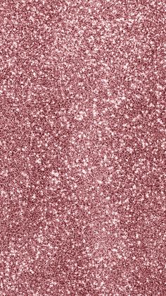 a close up view of a pink glitter background