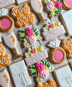 decorated cookies are arranged on a table