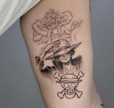 a woman with a hat and skull tattoo on her leg