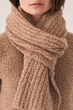 Teddy textured scarf. Wrap around your neck for full coverage and extra warmth. Teddy texture adds fullness to scarf. Wear with teddy beanie hat. ABLQ3F9 - 77% virgin wool / 19% silk / 4% polyamide- Casual comfort- Luxury at a great price- Length - 72 inches- Width - 13 1/2 inches Cozy Beige Scarves For Cold Weather, Beige Wool Scarves For Winter, Cozy Beige Soft Knit Scarves, Cozy Beige Soft Knit Scarf, Cozy Soft Wool Knit Scarves, Beige Knitted Scarf For Winter, Cozy Knit Scarves For Winter, Wool Scarves For Winter, Wool Scarves For Cold Weather