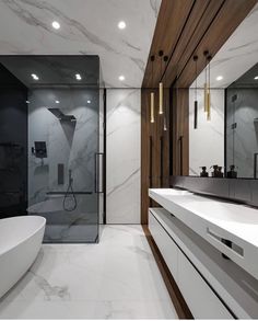 a modern bathroom with marble and wood accents