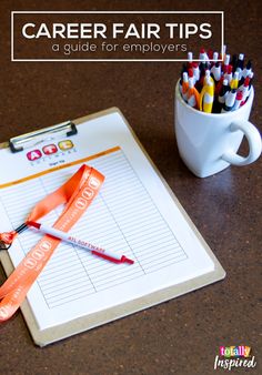 a clipboard with pencils and markers on it next to a cup full of pens