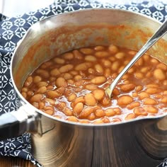 a pot filled with beans on top of a table