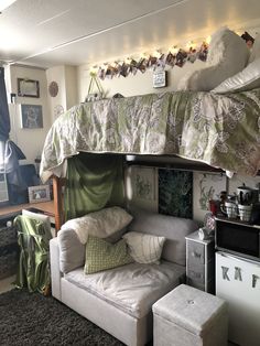 a loft bed with a couch underneath it