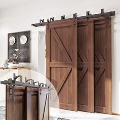 an open sliding door in a kitchen with wooden doors and black hardware on the side