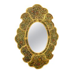 an ornately decorated mirror is shown against a white background