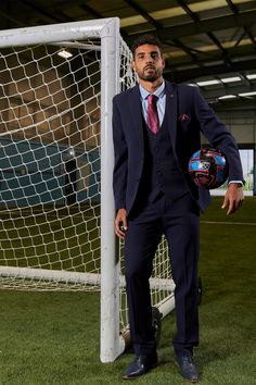 As worn by West Ham United left back Emerson Palmieri! This classic navy three-piece suit from The WHU Collection is designed to keep you looking sharp and feeling comfortable. The Prince of Wales check pattern is a timeless style for formalwear, and the elastane fabric guarantees a flexible fit for all-day wear. The classic navy hue is sure to be a hit at any dressy event. Features Slim fit Single-breasted waistcoat Prince of Wales check Notch lapel Single back vent Four button cuff Double butt Navy Tailored Three-piece Suit With Notch Lapel, Navy Three-piece Tailored Suit With Notch Lapel, Navy Three-piece Suit With Notch Lapel, Navy Fitted Three-piece Suit For Business, Navy Fitted Three-piece Business Suit, Navy Tailored Three-piece Suit, Tailored Navy Three-piece Suit, Navy Fitted Suits With Suit Collar, Navy Fitted Suit With Notch Lapel