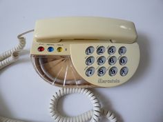 an old fashioned phone is sitting on the table