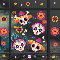 the day of the dead skulls are decorated with flowers and sombreros, as well as skull heads