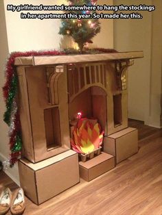 a cardboard house made to look like a fire place