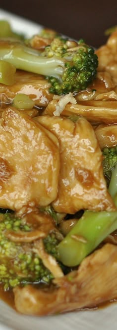 chicken and broccoli stir fry on a white plate