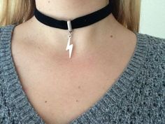 This is a handmade choker which is made from black suede and featuring a lightning charm. The charm hangs from a silver passerby element .The choker is 16mm wide and 33 cm long and with a chain on the back adjustable. Choker closing with silver lobster clasp. Ribbon Choker, Choker Necklace Designs, Handmade Chokers, Black Choker, Velvet Ribbon, Black Suede, Necklace Designs, Silver Charms, Cross Necklace