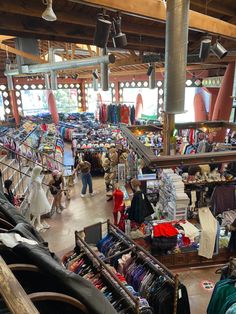 the inside of a clothing store filled with lots of items