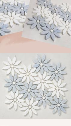 three different pictures of white and blue flowers on the wall, one is cut out to look like petals