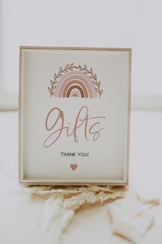 a white box with a rainbow on it and the words 9uff's thank you