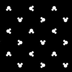 black and white mickey mouse wallpaper with many small dots on the side of it