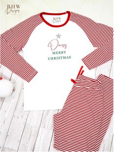 THESE ARE LIMITED EDITION CHRISTMAS STOCK, WE WILL NOT BE GETTING MORE STOCK IN THIS YEAR.  These Mens's Christmas Pyjamas are a soft white cotton with a classic red and white candy cane stripe on the top sleeves and bottoms. Made from 100% Cotton with Long sleeves for extra warmth on cooler nights. The bottoms are long with an elastic waist and drawstring tie for extra comfort and of course useful pockets. With a classic red and white candy cane stripe ultimate winter feel. A hand designed motif on the front with a glitter silver star your chosen name in red and Merry Christmas in green for an extra special personal touch. ♥Item is washable at up to 30 degrees, please Iron Inside Out♥ ♥ SIZE ♥ * Please see Images ♥ Matching♥ : Childrens :  Mens:  Shipping: * Your Order will be shipped via Adult Christmas Pajamas, Mens Christmas Pajamas, Christmas Pyjamas, Christmas Matching, Mens Pajamas Set, Candy Cane Stripes, White Candy, Matching Family Pajamas, Christmas Men