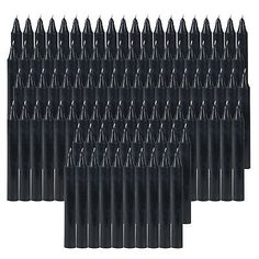 black plastic dows are lined up in rows on a white background, with the top row