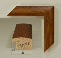 a piece of wood is shown with measurements for the top and bottom section, as well as its length