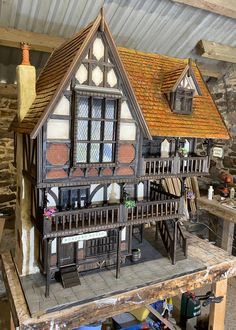 a doll house made out of wood and plastic