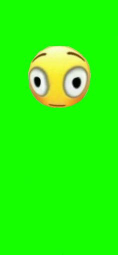 an animated yellow smiley face on a green screen with two eyes and one eye looking at the camera