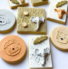 some cookies are decorated like animals and giraffes