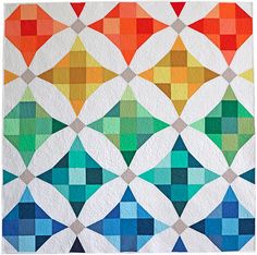 an abstract quilt with many different colors on it