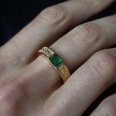 This stylish textured Emerald Dragon Ring was inspired by dragon scales. Handcrafted in 14K gold. This ring features a natural one-of-a-kind deep green emerald. Materials: 14K gold Natural 4.8x5.4mm natural emerald. Approx. 0.7ct Solid band 5mm bandwidth ** Tippy Taste Men's are made-to-order. Please allow 2-3 week turnaround time. This ring is not resizable, please ensure your ring size before ordering. Shipping:Domestic: Free standard shipping within the U.S.International: Free standard shippi Man Emerald Ring, Men's Emerald Ring, Men’s Wedding Band With Emerald, Emerald Engagement Ring Men, Men Emerald Ring, Men’s Emerald Ring, Men’s Ring, Emerald Green Wedding Ring, Men Rings Gold