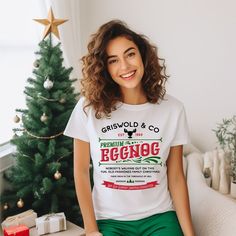 "This is a Christmas shirt from Griswold and company premium eggnog Chicago il Est 1989. It's a holiday tee with a retro feel that will make you look stylish and festive while celebrating the holidays with your loved ones. Welcome to the cozy corner of creativity! Our store is pleased to introduce our collection of quality t-shirts, sweatshirts, and hoodies that blend comfort, style, and self-expression. Embrace the warmth of our garments and let your unique personality shine through!  🎨 From trendy and chic to quirky and fun, our designs cater to all tastes and moods, making it easy to find the perfect match for your individuality. 🌟 Stand Out from the Crowd: Express yourself fearlessly! Whether you're an introvert looking to make a subtle statement or an extrovert who loves to turn hea Griswold Christmas, Dashing Through The Snow, Winter Shirts, Christmas Gnomes, Christmas Funny, Sweatshirts And Hoodies, Christmas Family, Christmas Tees, Cozy Corner